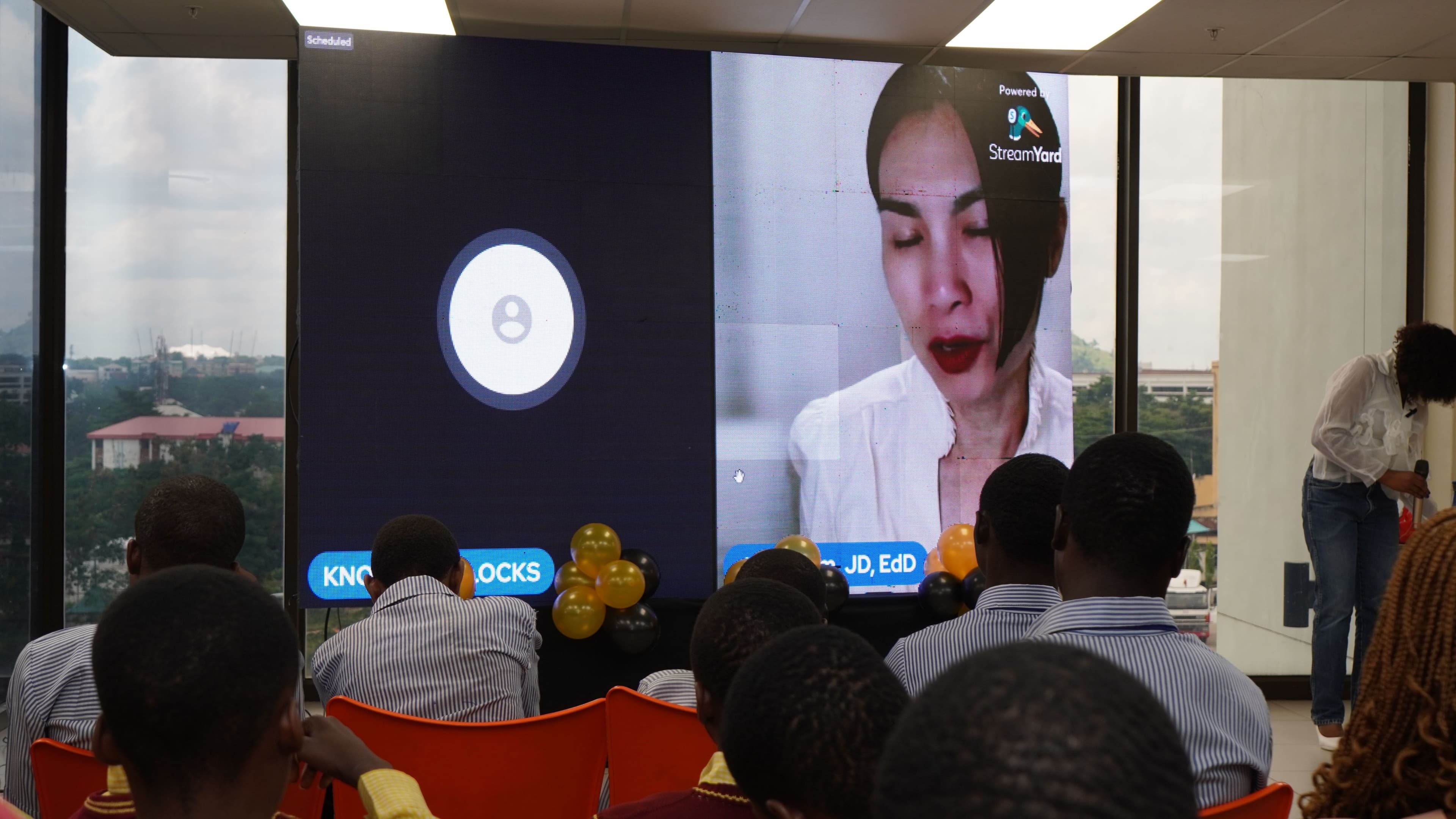 Dr Janie Dam speaking virtually to Nigerian students at a DAOit event