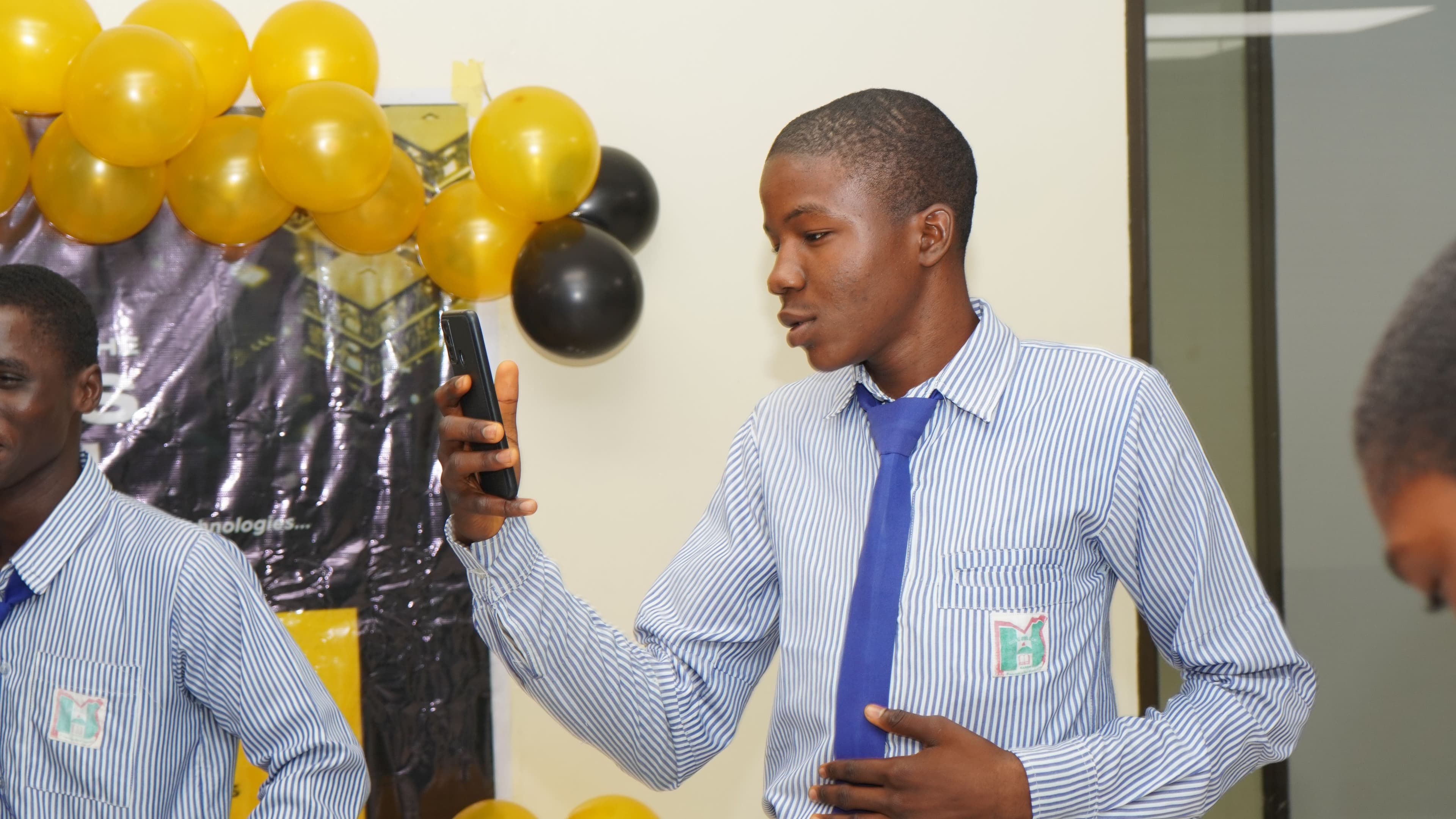Nigerian secondary school student using DAOit platform on a mobile phone